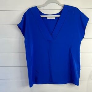 Vibrant blue 100% silk blouse. Cap sleeve.